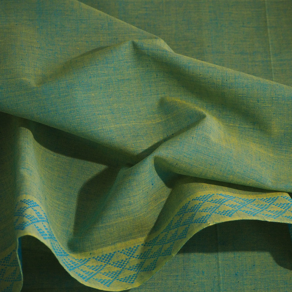 Hand woven turquoise cotton fabric with decorative borders