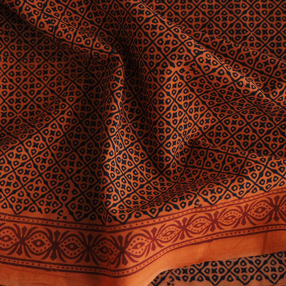 Bagh hand block printed orange/black cotton fabric