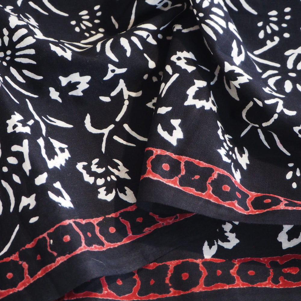 Bagh hand block printed black/white cotton fabric with red border