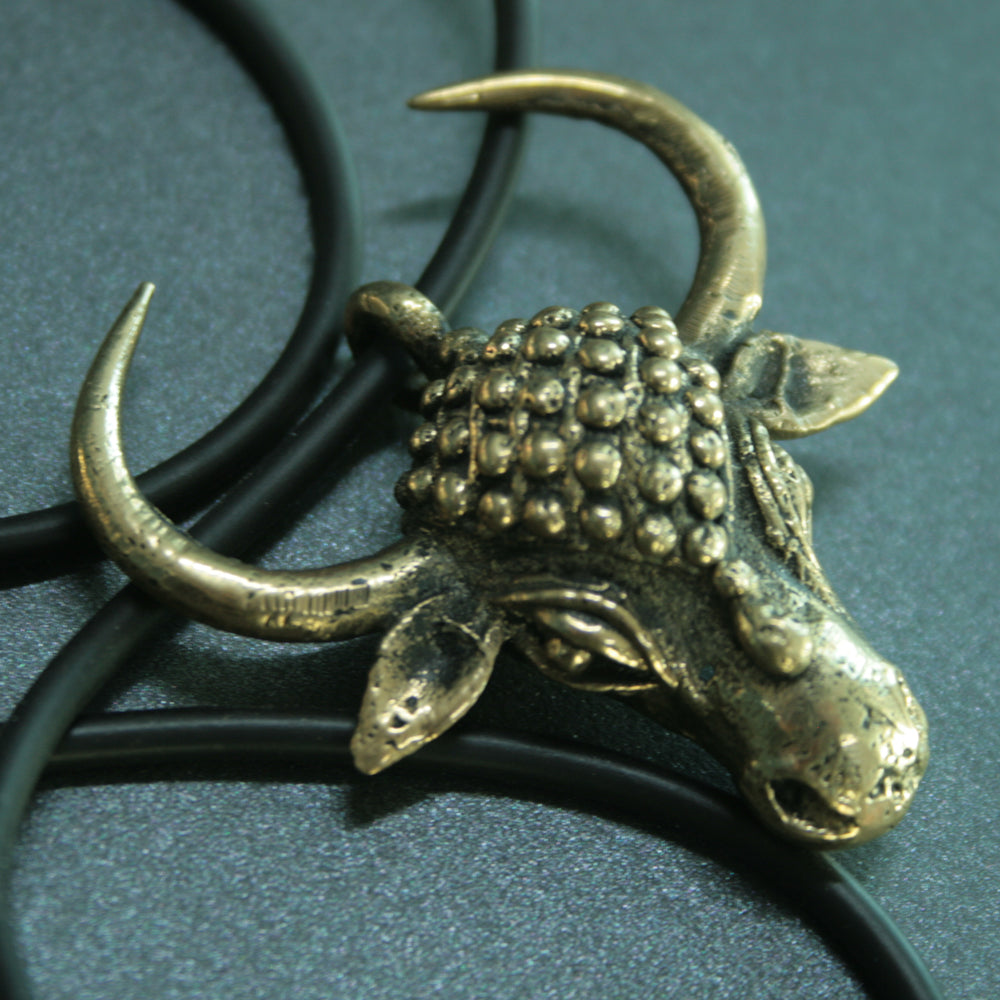 Cast bronze cow pendant